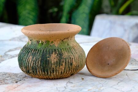 The Earthenware pot with moss open lidの写真素材