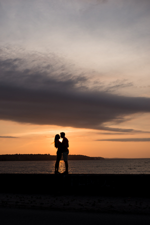 Couple in love on the background of beautiful sunsetのeditorial素材