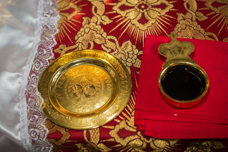 Wedding rings on a wedding ceremony in the church, wedding ceremony, glans. Detail from the church weddingの写真素材