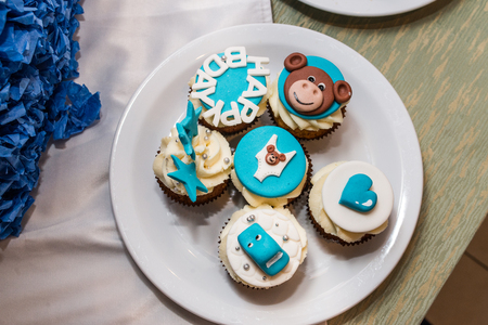 White and blue cupcakes for children's birthdayの写真素材