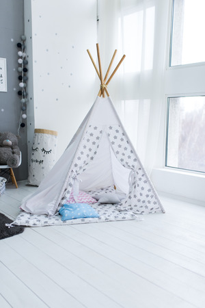 Tent-hut for children's games. Photo of Hut in the children's roomの写真素材