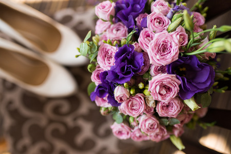 Bridal bouquet with pink and purple flowers. Wedding preparation. Wedding accessories. Bride`s morning. Wedding photoの写真素材