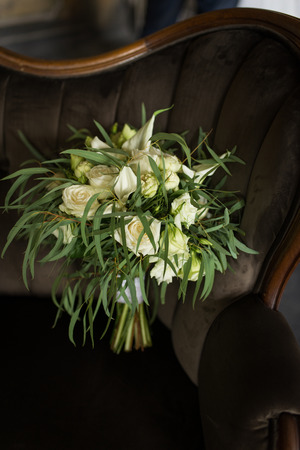 Lush stylish bridal Bouquet of white roses and a lot of greenery. Wedding.の写真素材