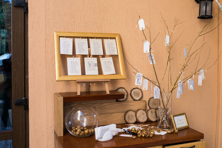 Wedding decoration. Golden walnut in a glass round vase. The wish treeの写真素材
