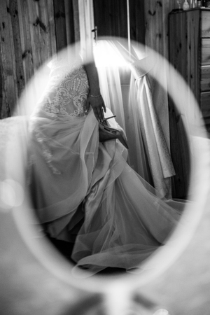 Reflection of the bride's shoes in the mirror. Black and white photo.の写真素材