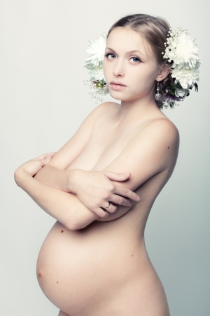 Studio shot of a young pregnant woman.の写真素材