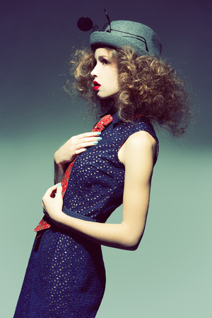 Studio photo of a young woman in fashionable things.の写真素材