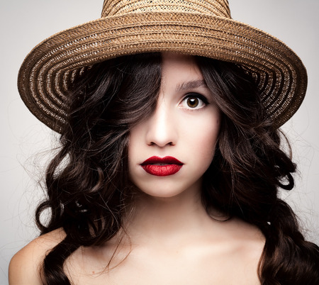 Studio photo of a young woman with accessories in a rustic style.の写真素材