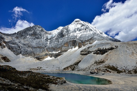 Under the snow capped mountain lakesの写真素材