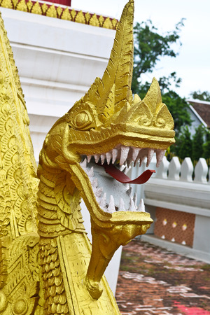 Golden Naga ladder sculpture in Lao temple, Laosの写真素材