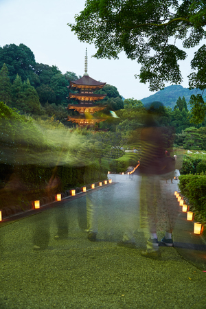 Yamaguchi City, Japan â September 10, 2017: Ruriko-Ji Temple, the candle lights festival. Lots of people walked pass the camera made motion in the photo.のeditorial素材