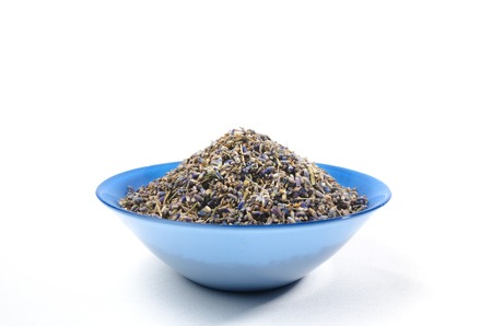 Dried lavender organic tea in wooden spoon Isolated on white background. On center sideの写真素材