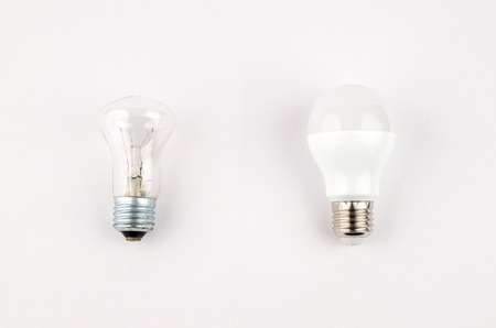 several LED energy saving light bulbs over the old incandescent, use of economical and environmentally friendly light bulb conceptの写真素材