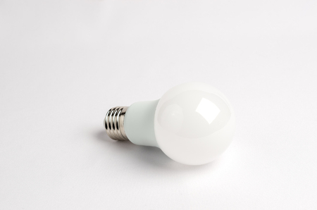 one LED energy saving light bulbs over the old incandescent, use of economical and environmentally friendly light bulb conceptの写真素材