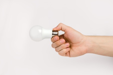 mans hand holding the LED lampの写真素材