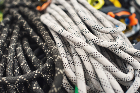 Used climbing equipment - carabiner without scratches, climbing hammer, white helmet and...