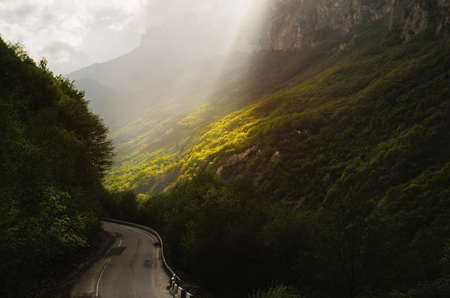 A fabulous landscape in the Caucasus mountains with a change of weatherの写真素材