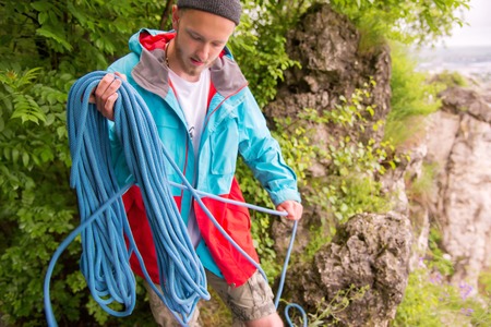 Portrait of a young hipster, training equipment for climbing.の写真素材