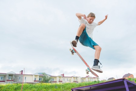 Young skateboarder in a jumpの写真素材