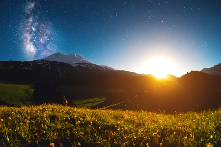 Night starry landscape of Mount Elbrus at sunset of the moonの写真素材