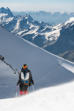 professional climbers go to the western peak of Elbrusの写真素材