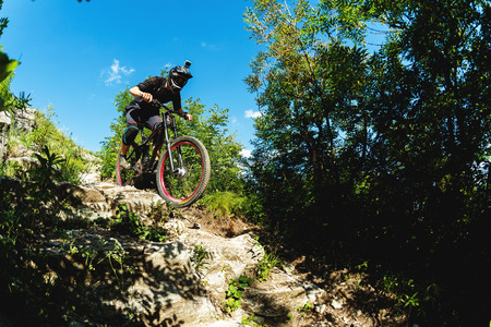 Sport. A cyclist on a bike with a mountain bike in the forestの写真素材