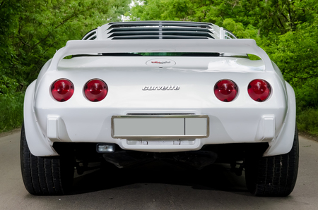NEVINOMYSSC, RUSSIA - MAY 13, 2016: Automobiles. Offsite photography of old American cars. Chevrolet Corvette C3 1978s. Rear view of machine on a country road in a forestのeditorial素材