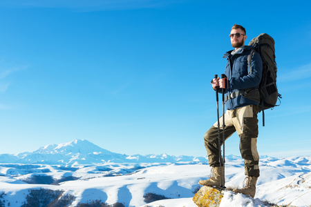 A hipster traveler with a beard wearing sunglasses in nature.の写真素材