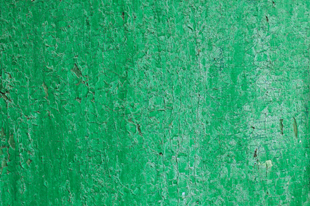 Texture of a wooden board in green. The chapped green paint on the surface of the turfの写真素材