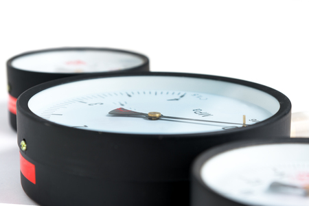 Close-up Pressure sensors in the pipeline - mono-meters. Three monometers of different sizes on a...