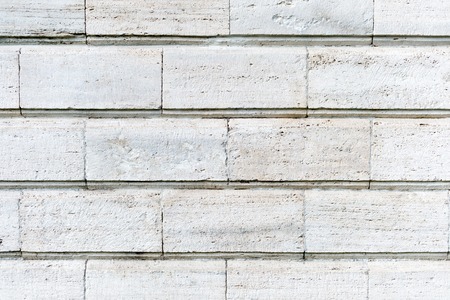 Old stone cladding plates on the wall closeupの写真素材