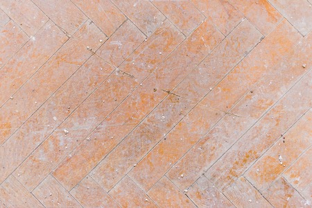 A close-up of an old faded parquet covered with dust and dirt. Result of repair. Cleaning and...