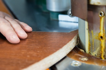 Carpenter works for Edge Banding Machine In workshopの写真素材