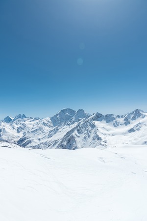 Winter snow covered mountain peaks in Caucasus. Great place for winter sportsの写真素材