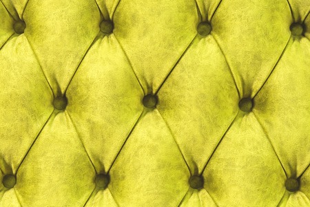 Velor surface of sofa close-up. Training equipment-velor mats tightened with buttons. Yellow...