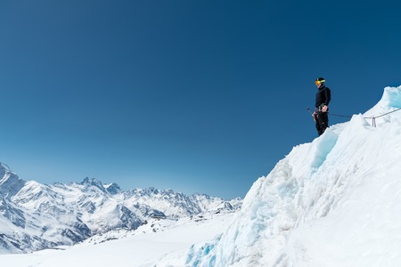 Mountain guide candidate training ice axe and rope skills on a glacier in the North Caucasusの写真素材