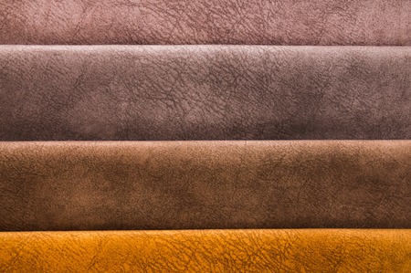 Colorful and bright fabric samples of furniture and clothing upholstery. Close-up of a palette of textile abstract stripes of different colorsの写真素材