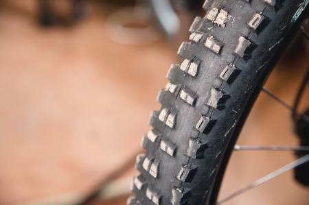Mountain bike tire tread closeup at home workshop