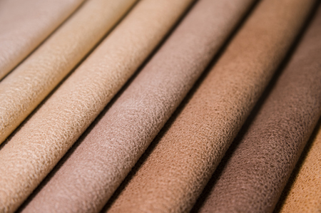 Colorful and bright fabric samples of furniture and clothing upholstery. Close-up of a palette of textile abstract stripes of different colorsの写真素材