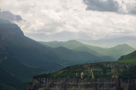 Dramatic landscape of a green valley at the foot of the Inal Plateau in the North Caucasusの写真素材