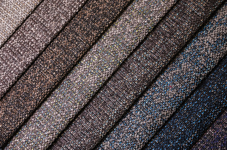 A set of samples of fabric furniture decoration lines of textile textures. Multicolored stripes upholstery. Mode and tone for a luxurious interior style. Abstract backgroundの写真素材