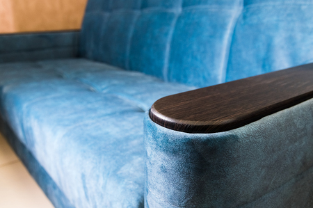 Close-up handle armrest textile blue sofa. New furniture. Shallow depth of fieldの写真素材