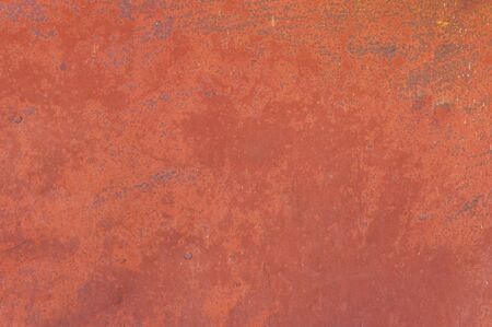 Fine texture of a rusty metal surface once painted redの写真素材