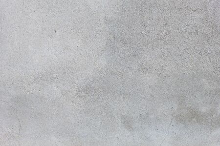Gray textured cement wall background with fine concrete chips. Construction backgroundsの写真素材