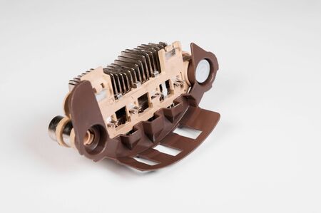 Close-up of a new relay regulator equalizing the voltage in the generator. New auto parts