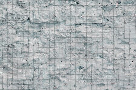 Building background prepared surface of the facade wall of the building with a fixed rusted mesh for...
