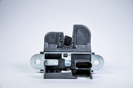 New tailgate lock with electric drive and plastic protection on a gray background.
