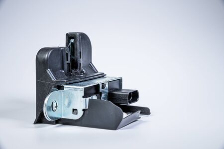 New tailgate lock with electric drive and plastic protection on a gray background