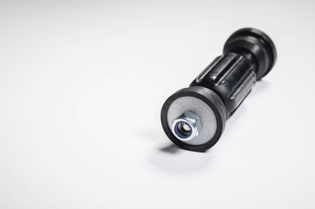 Car front suspension anti-roll bar mount. New tie rod on gray backgroundの写真素材