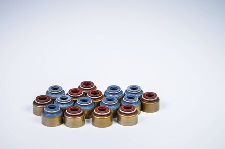 A set of new knee valves on an internal combustion engine on a grey gradient background